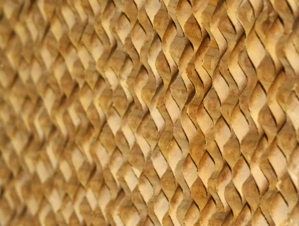 Close-up of a woven diamond pattern with light and dark brown strips, similar to Kuul Evaporative Media, enhancing cooling efficiency.