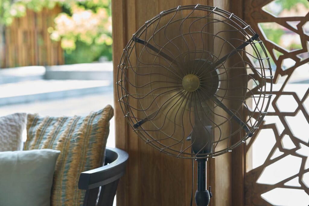 Why do outdoor fans stop working? This metal fan stands in the corner.