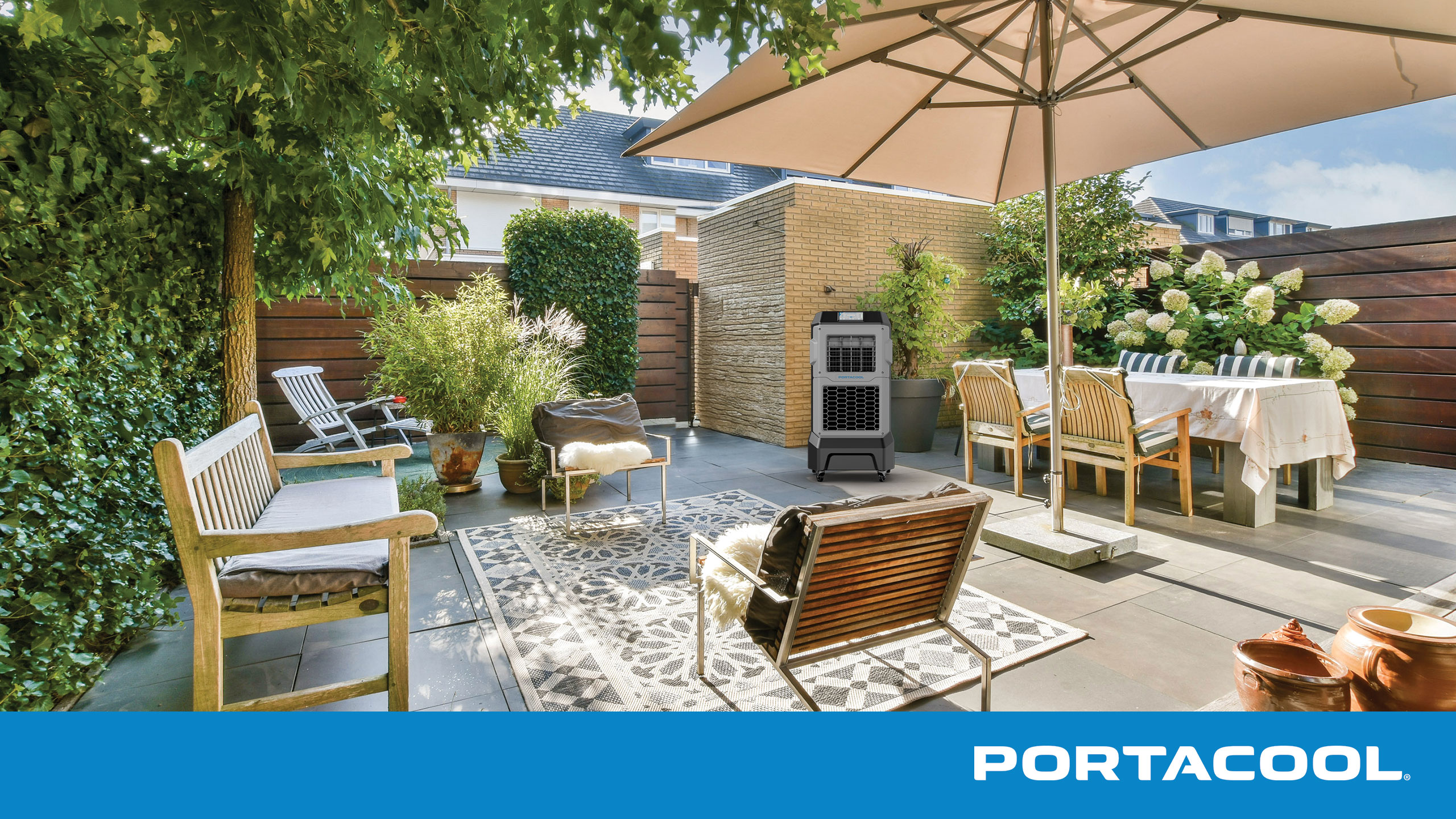 An outdoor patio being kept cool by a Portacool evaporative cooler.