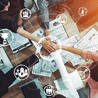 A diverse group unites hands over business documents, symbolizing teamwork. Growth icons show collaboration like strategizing for a Portacool honor.
