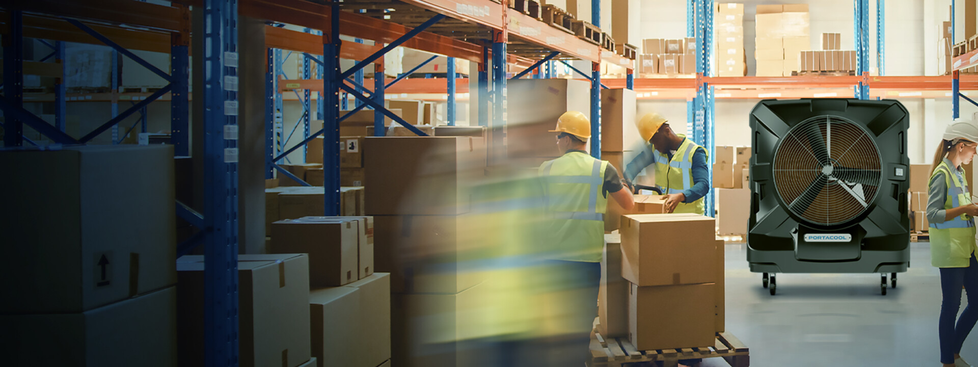 Warehouse workers in helmets and vests organize boxes; one worker uses a tablet.