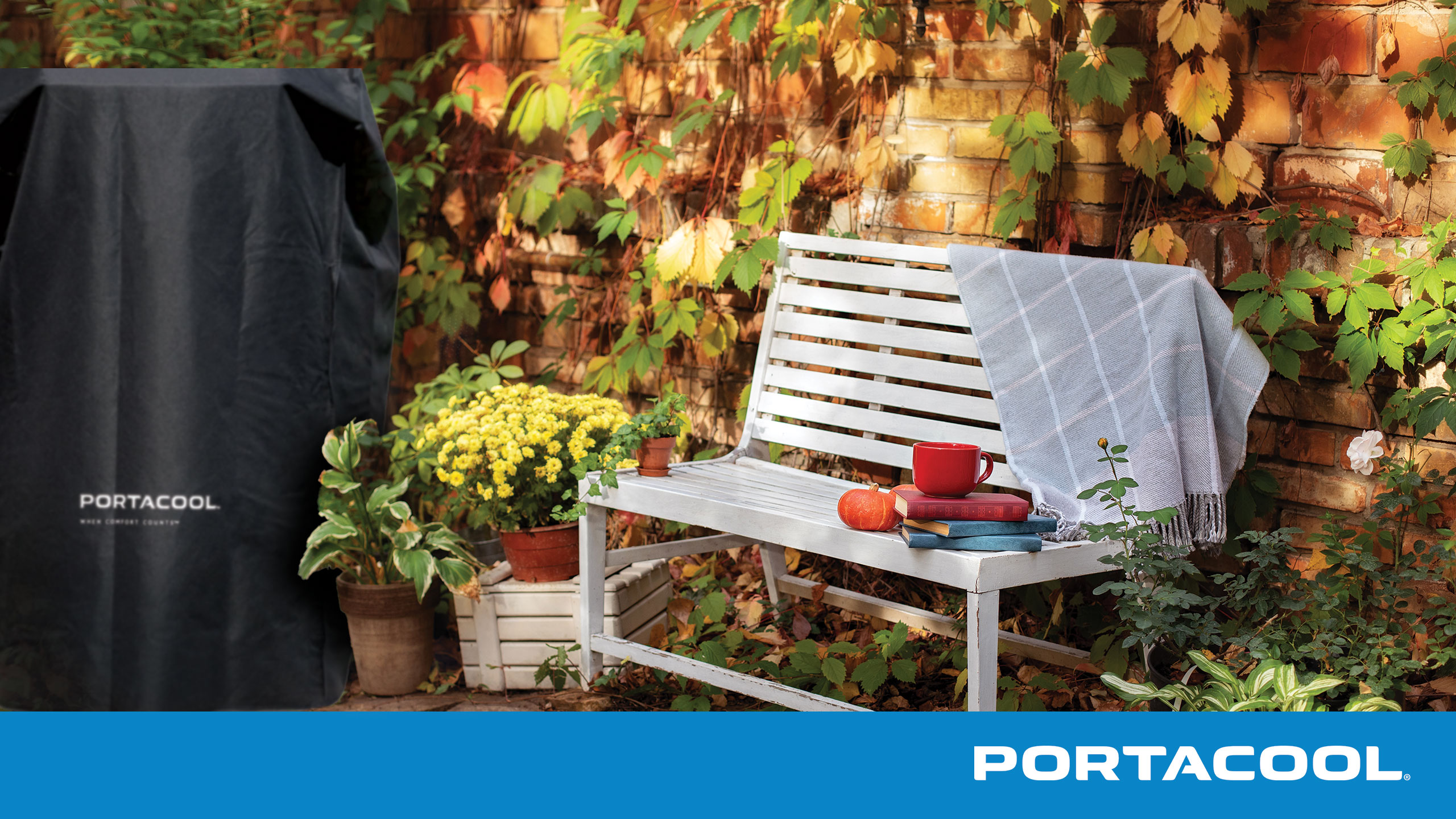 A back patio in the fall with books on a bench, and a Portacool under a protective cover after being prepared for seasonal storage.